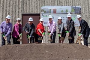 DC Group groundbreaking ceremony, May 29th. From left to right: Charlie Kramer, CFO DC Group, Barbara Johnson, Minneapolis City Council President, Blong Yang, Minneapolis Fifth Ward Council Member, Linda Higgins, Hennepin County Commissioner, Jon Frank, CEO of DC Group, Katie Clark Sieben, Commissioner of Minnesota Department of Employment and Economic Development, Todd Klingel, Minneapolis Regional Chamber of Commerce President, Noah Bly, UrbanWorks Architecture